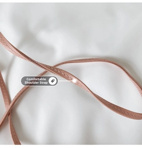 Macro shot of pink leather shoulder strap with high-quality stitching detail
