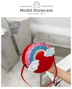 Detail of red round girls' purse featuring sequined rainbow and iridescent cloud patches