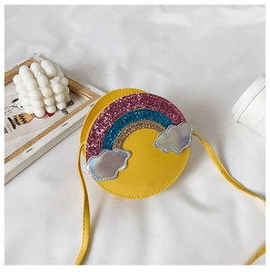 Detail view of yellow circular girls handbag with rainbow sequins and silver glitter clouds