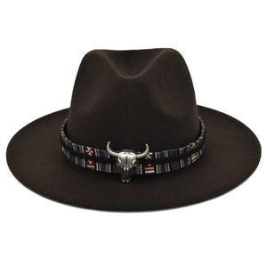 Close-up of brown wool fedora with ethnic band and silver bull head ornament