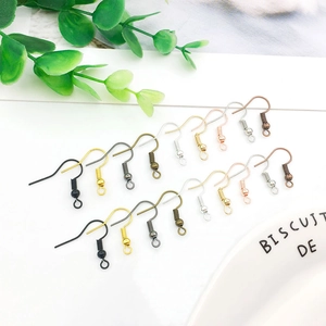 Assorted DIY jewelry ear hooks in various metallic finishes on a white background