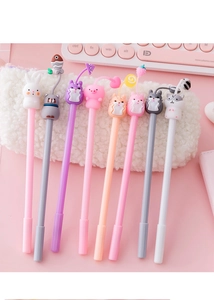 Close-up of eight cartoon animal gel pens with silicone charms on a plush pouch