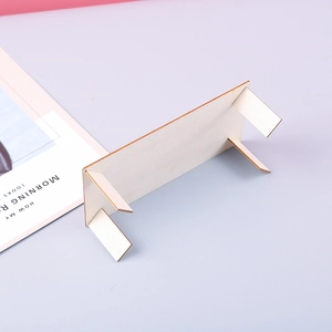 Detail view of the miniature wooden display stand with four legs for DIY craft projects