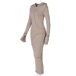 Detailed close-up of beige hooded dress featuring contrast stitching and thumbhole cuffs