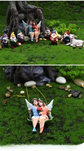 Detailed set of resin garden fairies and colorful gnomes on artificial moss