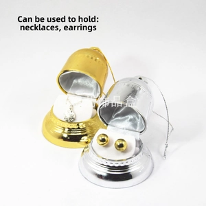 Macro view of bell-shaped jewelry gift boxes with gold and silver electroplated finish
