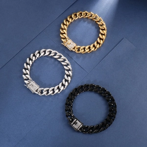 Detailed close-up of Cuban link bracelets in gold, silver, and black with sparkling rhinestones