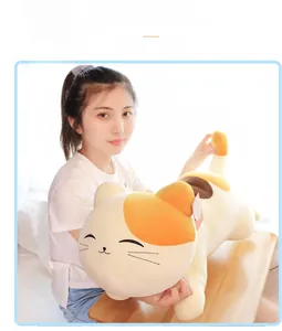 Detail of soft plush cat long pillow featuring cute embroidery and smooth velvet fabric