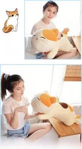 Detail showing plush calico cat pillow with embroidered closed-eye smile on soft fabric