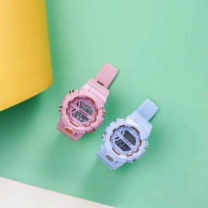 Detail of pink and blue digital sports watches with silicone strap and large screen