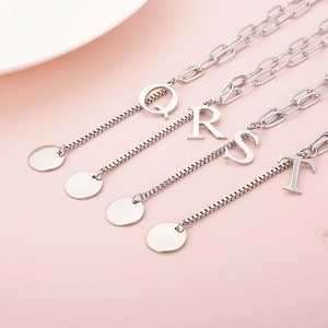 Minimalist silver letter necklaces featuring Q, R, S, T alphabet pendants for women
