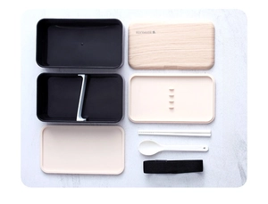 Detailed view of the double-layer lunch box set with utensils and wooden style lid