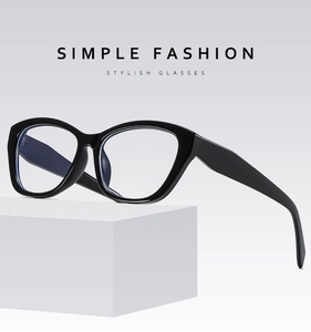 Close-up of cat-eye black glasses frame with anti-blue light lenses on a stand
