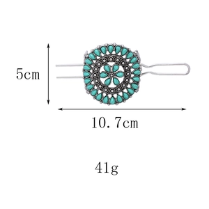Detail view of retro flower hair pin with turquoise stones showing 10.7cm length and 41g weight