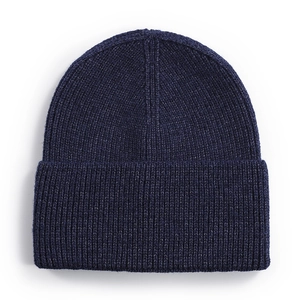 Thick ribbed knit beanie in deep blue with wide cuff for winter warmth and outdoor use