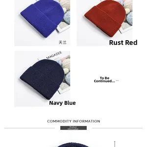 Detail of knitted beanies in light blue, rust red and navy with thick ribbed cuff design