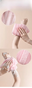 Detail showing dual-texture pink exfoliating back scrubber for bath cleaning