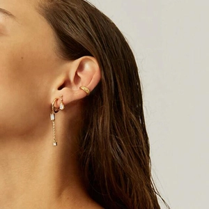 Elegant s925 silver needle drop earrings with sparkling crystals on a model