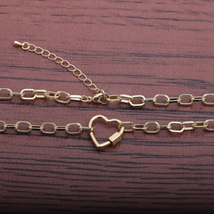 Collier à maillons cubains dorés avec boucle à ressort en forme de cœur et zircon