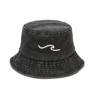 Vintage washed denim bucket hat with 3D wave embroidery and metal eyelets on white background