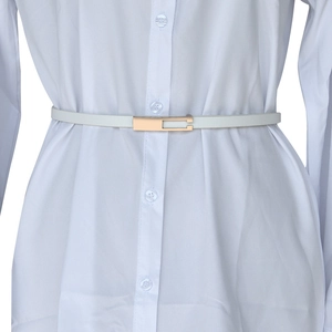 Detail view of a slim white leather belt with a gold rectangular buckle on a shirt