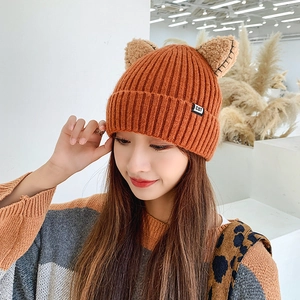 Orange knitted cat ear beanie for women featuring a warm winter crochet design and CAT label