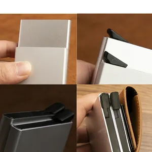 Slim RFID blocking metal wallet card holder showing the push-button pop-up mechanism