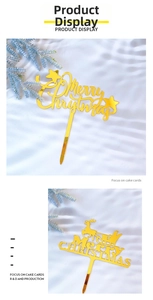 Close-up of golden mirror acrylic Merry Christmas cake toppers with reindeer designs