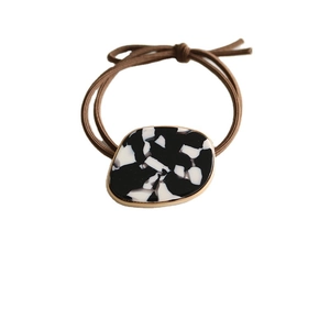Minimalist elastic hair tie with marble pattern acetate charm and gold metal rim