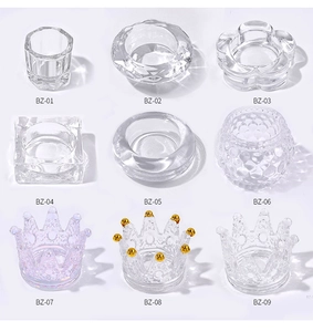 Macro detail of various crystal glass nail art liquid cups with distinct geometric patterns