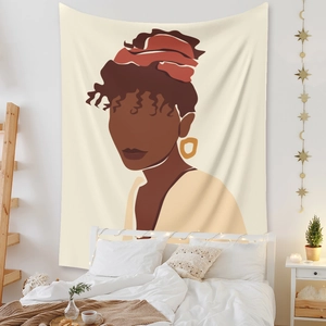 Detail of bohemian wall tapestry showing an African woman portrait in a modern bedroom