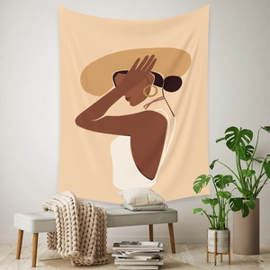 Artistic bohemian wall tapestry featuring a woman silhouette in a warm interior setting