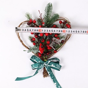 Detail view of 20cm heart-shaped Christmas wreath with red berries and silver reindeer
