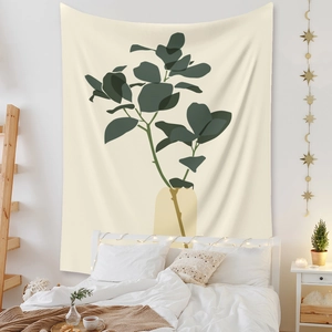 Bohemian style tapestry featuring abstract green botanical art in a warm bedroom setting