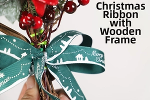 Detail of Christmas ribbon with Merry Christmas text, red berries and green pine needles