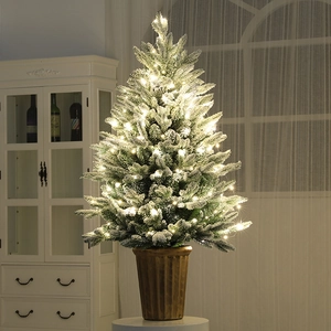 Mini PE snow flocked Christmas tree with warm LED lights in a gold striped pot