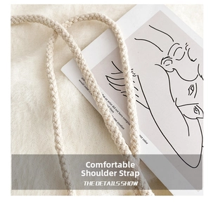 Detail of cream braided shoulder strap with twisted rope texture on soft fur background