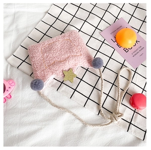Detailed texture of pink plush crossbody bag with star sequins and rope strap
