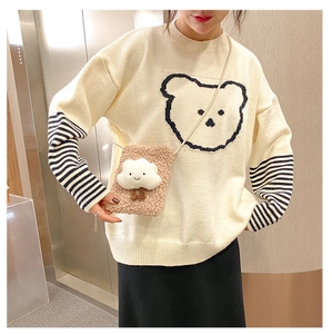 Close-up of a white plush cloud-shaped crossbody bag with a cute bear knit sweater outfit