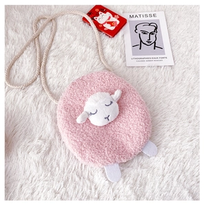 Close-up of pink plush lamb crossbody bag with soft fleece texture and rope strap