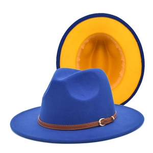 Detail of blue wool fedora hat featuring a contrasting yellow interior and leather strap
