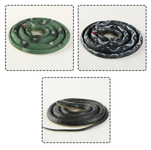 Detailed view of three realistic rubber toy snakes in green, black, and striped patterns