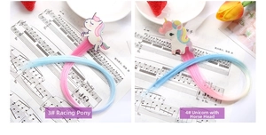 Detail of cartoon unicorn hair clips with long colorful rainbow synthetic hair extensions