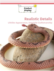 Detailed realistic brown snake toy with scales and red tongue on a stone background