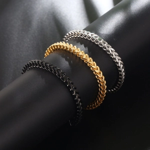Three-color woven stainless steel square link bracelets in black, gold, and silver finishes