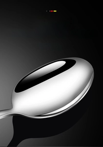 Macro shot of wide stainless steel spoon head with a high-quality brushed metal texture
