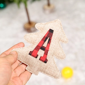 Linen Christmas tree ornament featuring a red and black plaid letter A decoration