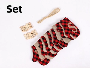Detail view of mini Christmas stocking banner set with rustic linen socks and wooden clips