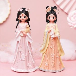 Cute ancient Chinese style girl figurines in pink and yellow Hanfu with cat ornaments