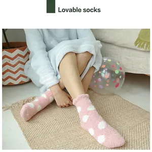 Soft pink coral fleece socks with white polka dots for warm winter home wear